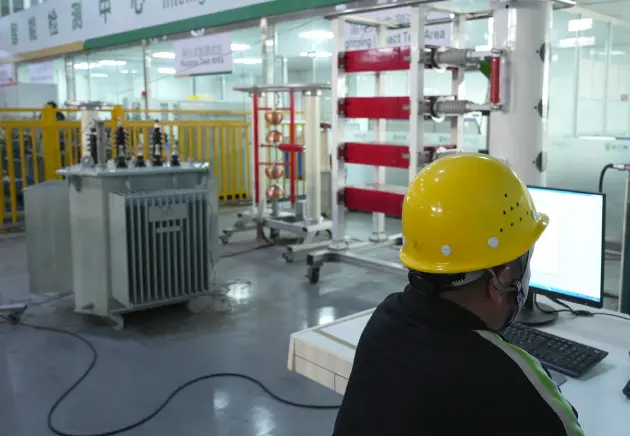 OMEK worker is testing a distribution transformer