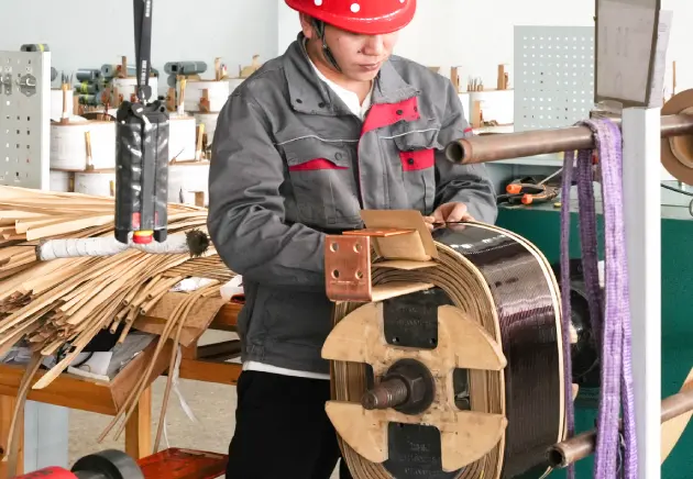 China OMEK Power's worker is working on the 15 kva single phase transformer's copper windings
