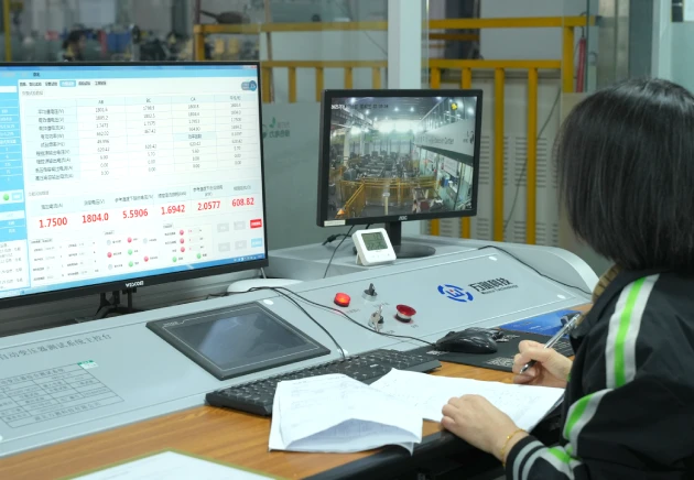 Technician operating a transformer loss measurement system for short-circuit impedance and load loss test